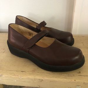 Chocolate leather Mary Janes.